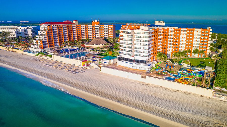 Crown Paradise Club Cancun all-inclusive family resort with water slides, pools, and beachfront access in Cancun.