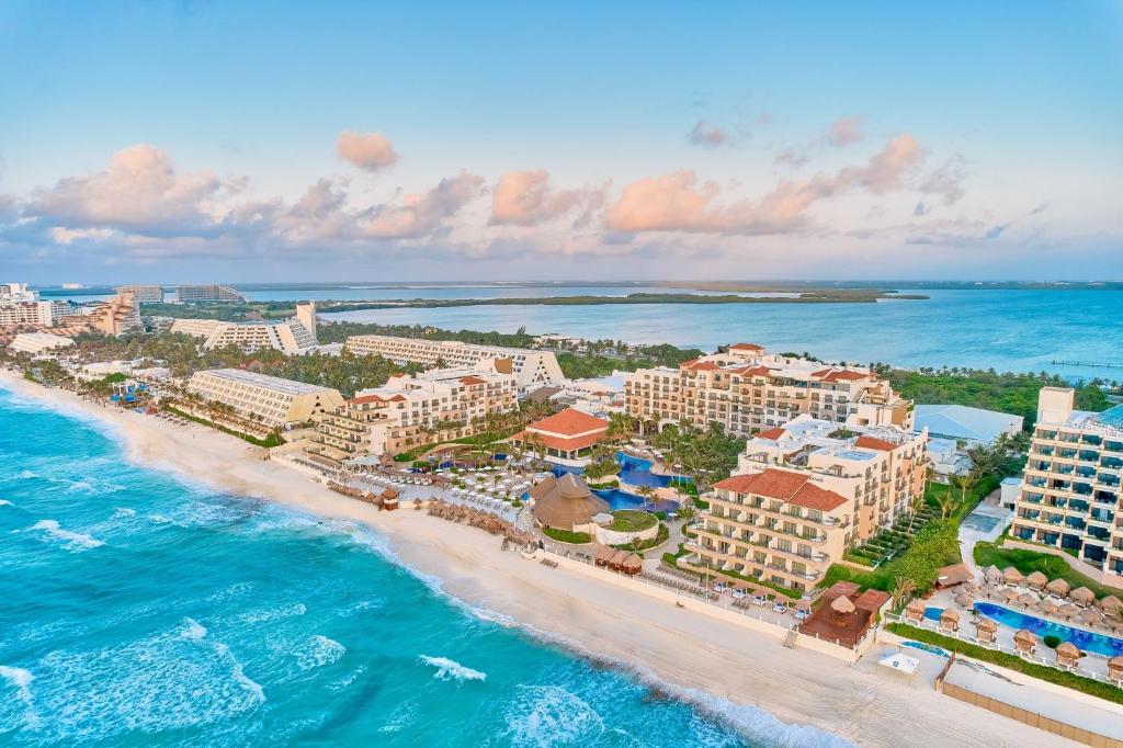 Fiesta Americana Condesa Cancun all-inclusive resort with beachfront location, pyramid architecture, and tropical pools in Cancun Hotel Zone.
