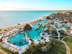 Moon Palace Cancun mega all-inclusive resort with expansive pools, golf course, FlowRider, and luxury amenities in Riviera Maya.