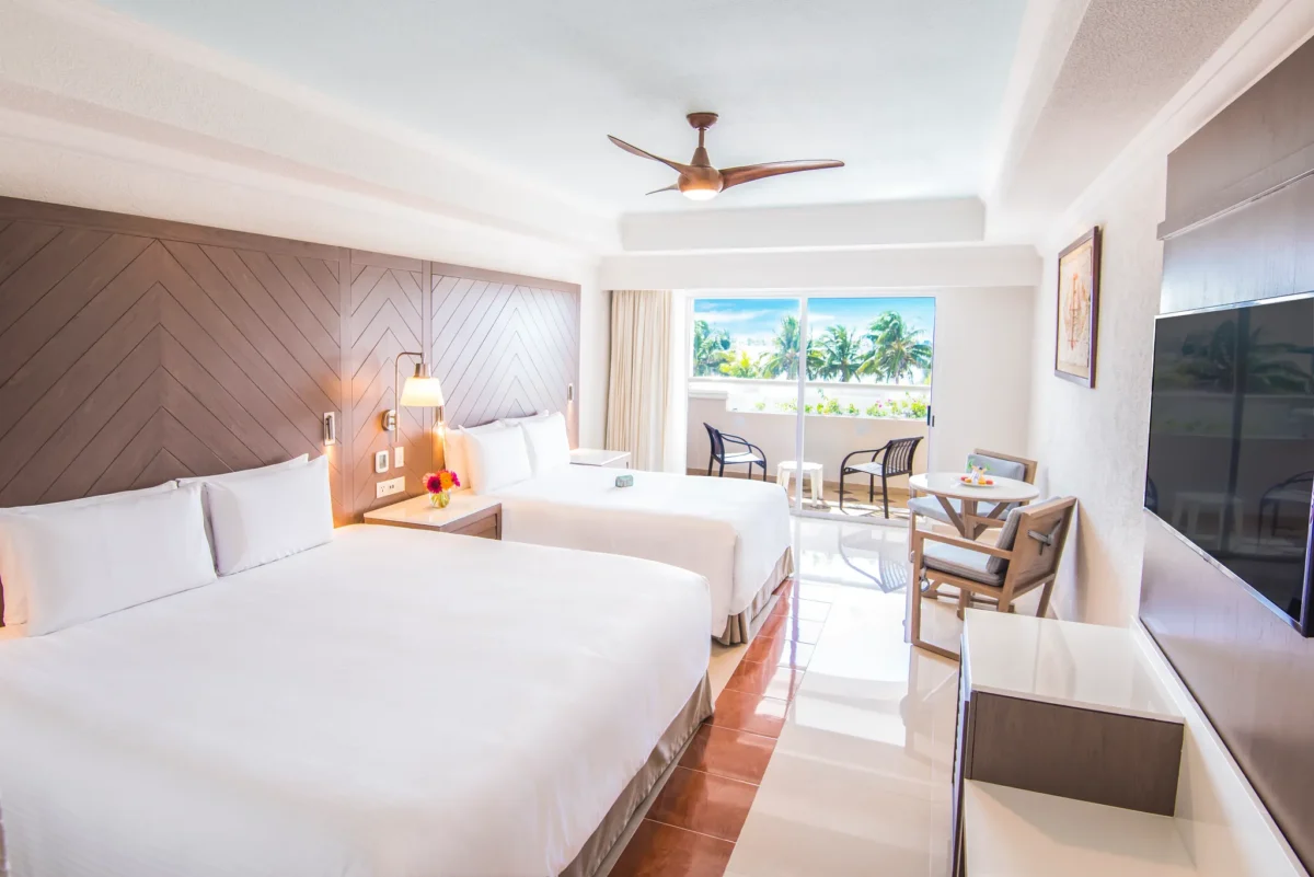 Double Standard Room with two beds and private balcony at Sunscape Cancun Resort & Spa.