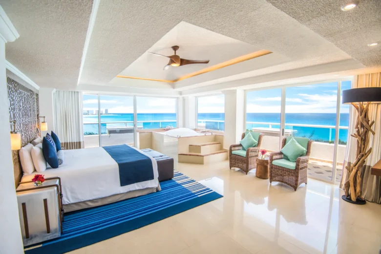 Presidential Suite bedroom with ocean views at Sunscape Cancun Resort & Spa.