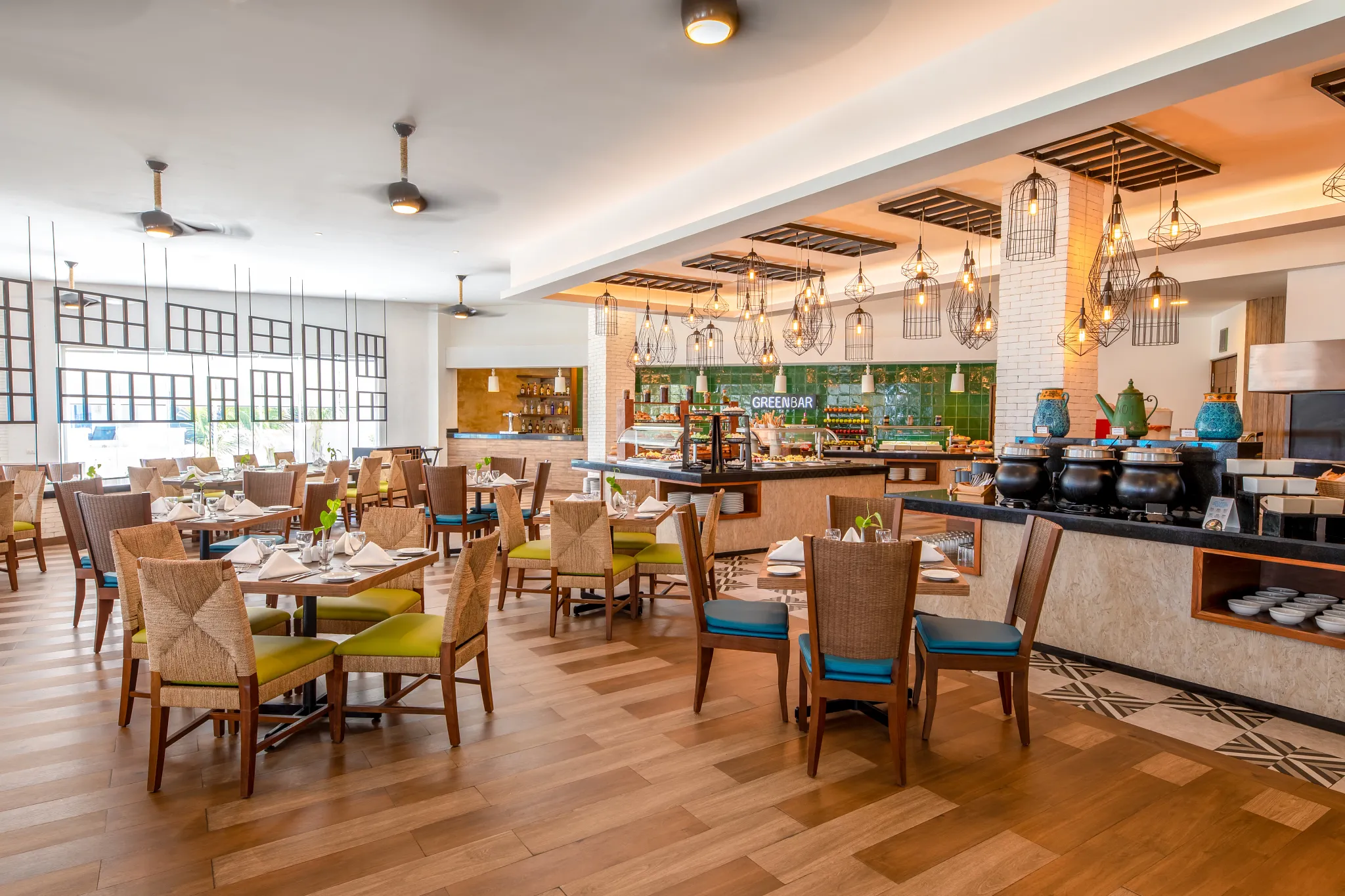 Ventanas restaurant at Sunscape Cancun Resort & Spa featuring contemporary dining décor, elegant seating, and panoramic resort views.