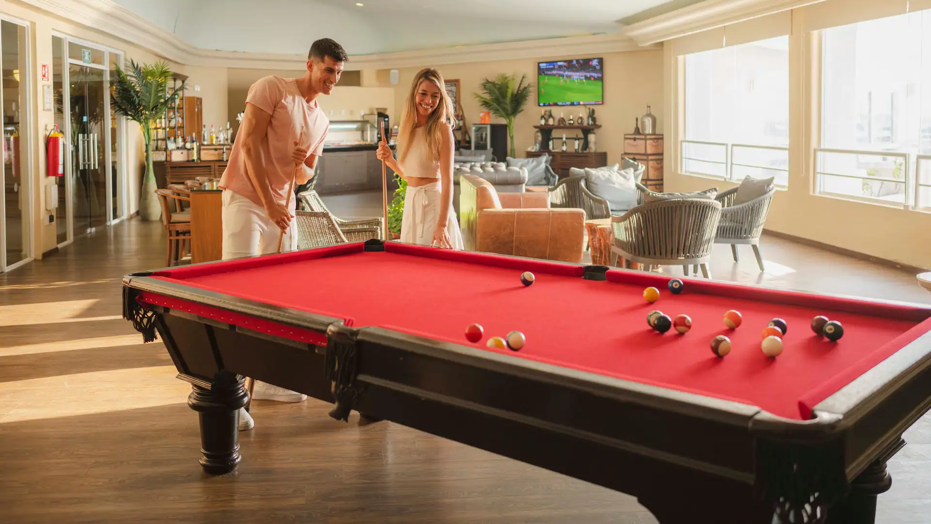 Guests playing billiards inside the VIP lounge at Sunscape Cancun Resort & Spa in Cancun.